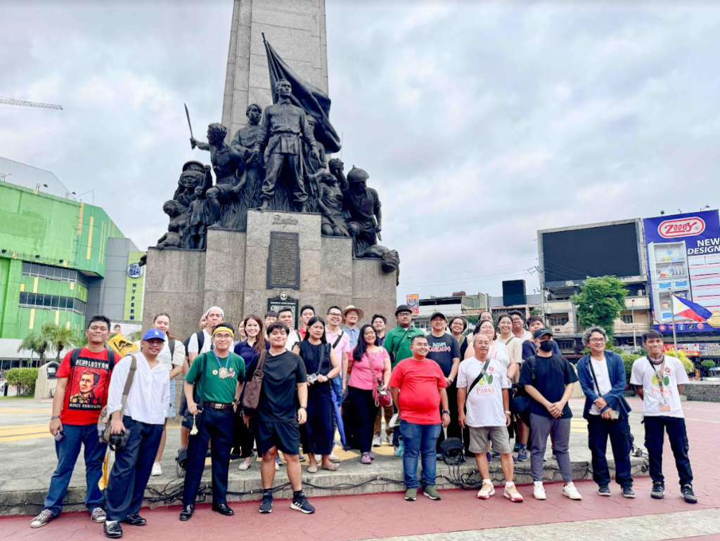 The participants during the pilot run of LRT-1 ikotMNL Heritage Transit Tour at the Bonifacio Shrine inCaloocan City, one of the many sites to be visited included in the North Route Tour.