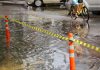 Passenger Steps In To Help Elderly Pedicab Driver Through Floodwaters